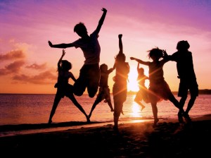Kids dancing on a beach
